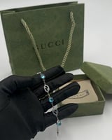 سوارة قوتشي فضي وأزرق