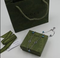 سلسال قوتشي فضي وازرق