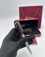 قلم كارتييه اسود باطراف فضيه
