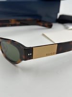 نظارة قوتشي بنيه