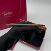 قلم كارتييه لون فضي و ذهبي