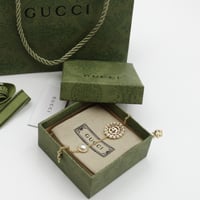 سوارة قوتشي ذهبي دائرية