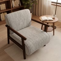 كرسي لاونج مودرن بتنجيد رمادي فاتح وملمس ناعم مع إ...