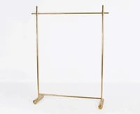 علاق ملابس استيل ذهبي