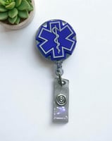 حامل بطاقة مع شعار مجسم نجمة الحياة