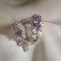 اقراط امثيست