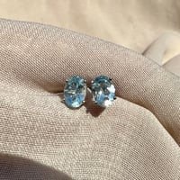 اقراط توباز