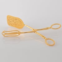 ملقط كيك معدن ذهبي