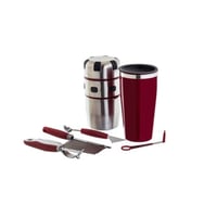 عصارة برتقال مع كوب وادوات تقطيع