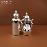 طقم ترامس غلا 2 قطعة فضي ( 1 لتر - 650 مل ) داخل ز...