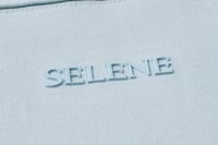 تيشيرت إنترلوك أزرق سماوي للجنسين