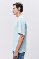 تيشيرت إنترلوك أزرق سماوي للجنسين