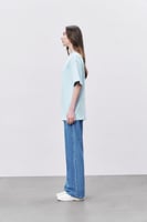 تيشيرت إنترلوك أزرق سماوي للجنسين