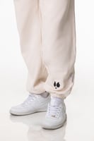 بنطلون سيلين بقصة ضيقة من الأسفل كريمي