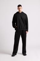 هودي بطباعة وقصة واسعة Acid Wash للجنسين أسود