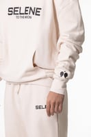 بنطلون سيلين بقصة ضيقة من الأسفل كريمي