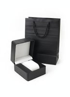 A watch with accessories, box, and bag