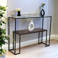 طاولة مدخل كونسول بإطار معدني أسود وسطح زجاجي مع ر...