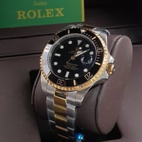 ساعة رولكس رجالية ايطار ذهبي واسود