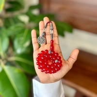 مسباح فاتوران أحمر شفاف طرابزونة سوداء