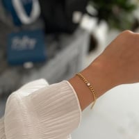 سوارة ذهبي مطلي بكرستالة دائري ( مع كيس وعلبة المو...