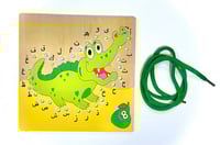 لعبة الخيط والثقوب تمساح