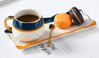 كوب قهوة سيراميك بتصميم مميز مع طبق تقديم وملعقة