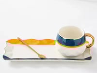 كوب قهوة سيراميك بتصميم مميز مع طبق تقديم وملعقة