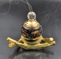 مبخرة سيراميك بقاعدة خشبية في السعودية