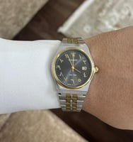 ساعة كاسيو casio MTP لونين ارقام عربية اسود