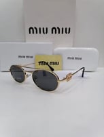 نظاراة Miu miu اسود اطار ذهيي