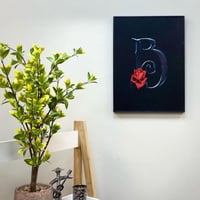 لوحة خشبية باطار لحرف B