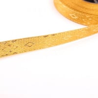 شريطه قصب - ذهبي منقوشه - عرض 0.5 انش