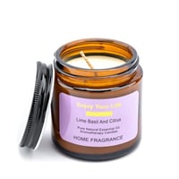 شمعة معطرة في حامل زجاجي بغطاء معدني برائحة الحمضي...