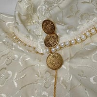 ازارير جنيهات ذهبية كبيرة