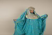 لبس المديني السماوي للعروسه