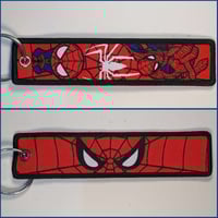 ميدالية سبيدرمان ، صورة مختلفة لكل وجه.