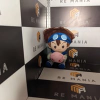 دمية أمجد تايتشي من أبطال الديجيتال مع المرافق.