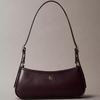 شنطة كتف كالفن كلاين لون برغندي