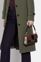 حقيبة كوتش الجديدة جريس ميني قماش مميز