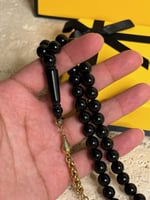سبحة بكلايت اسود مع شكة ذهبيه من استنلس استيل نفس...