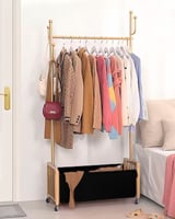 علاقة ملابس ذهبي مع سلة سفلية جلد اسود