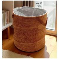 سلّة غسيل دائرية أنيقة بلون بني دافئ ونسيج مخملي ج...