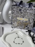 إسوارة Christian Dior فضي