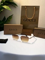 نظارة gucci - إطار ذهبي - عدسة بني مدرج