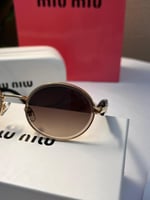 نظارة miu miu إطار بني غامق - عدسة بني مدرج
