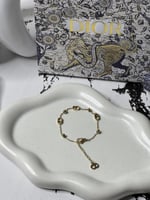 إسوارة Christian Dior ذهبي