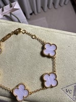 إسوارة Van cleef ذهبي - فيروزي مخطط