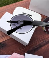 نظارة miu miu إطار أسود - عدسة اسود مدرج