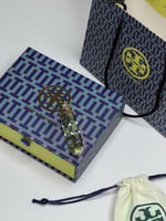 سوارة TORY BURCH مقاس 14 سم معدن ذهبي
